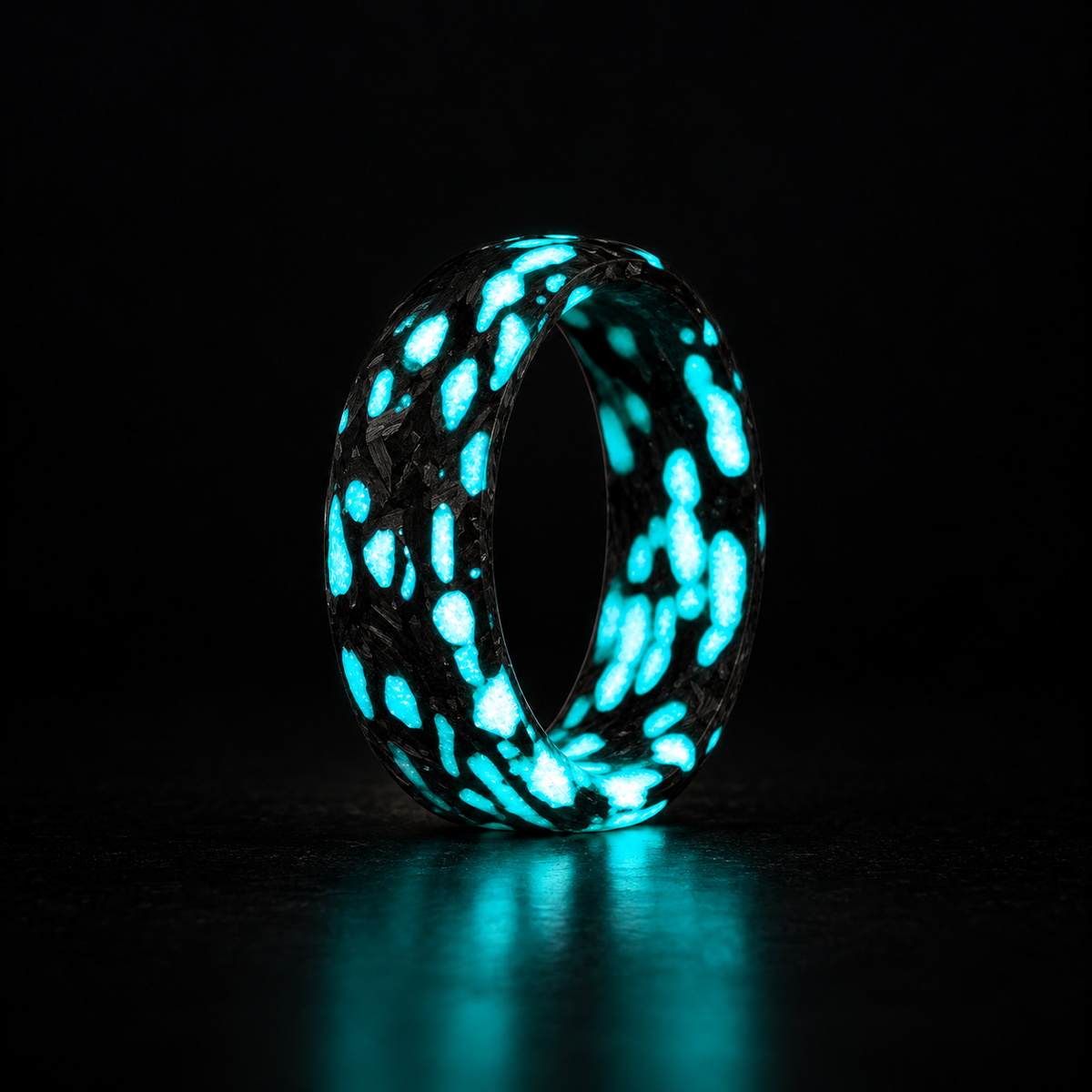 Alien blue glow carbon fiber ring on a dark background